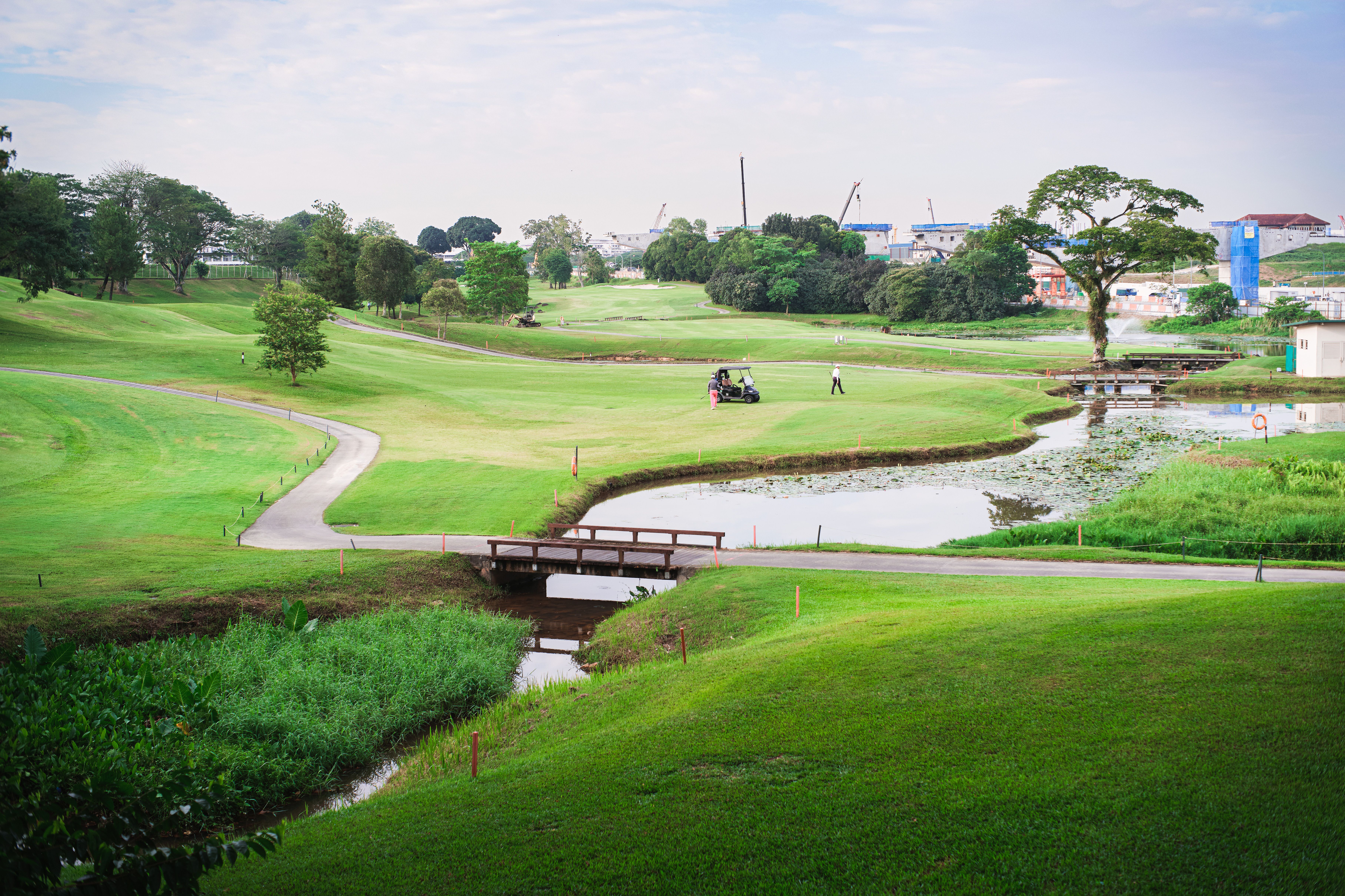 Golf course landscape with water and greenery